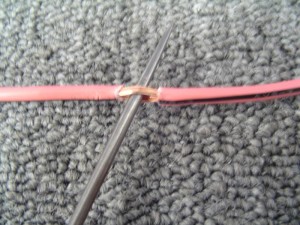 Use awl to open wire