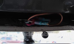 Once connections are made, tuck the cables into the existing console hole